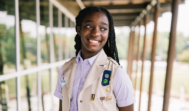 older girl scout outside