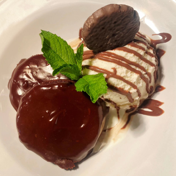 Two Thin Mints® Cookie Brownies served with Mint Ganache and Vanilla Ice Cream