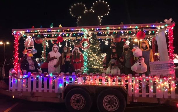 Troop 2300 standing on a holiday parade float