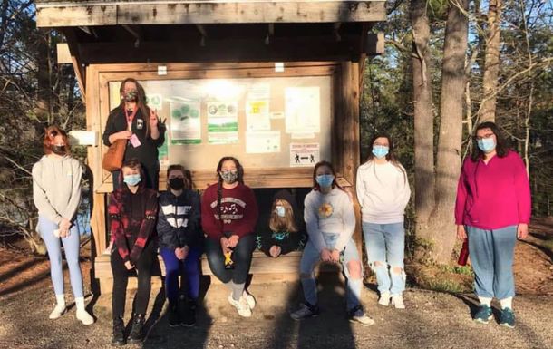 Troop 2300 standing in front of a bulletin board