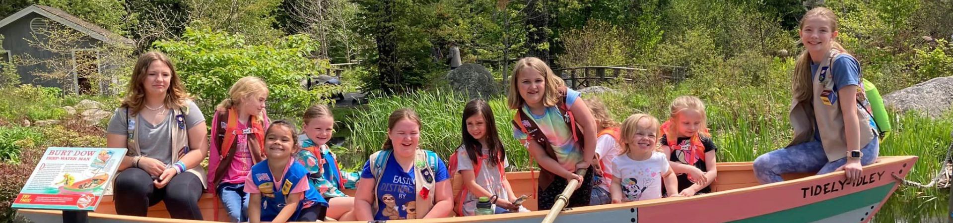  Girl Scouts from Troop 1545 in a boat at the botanical gardens 