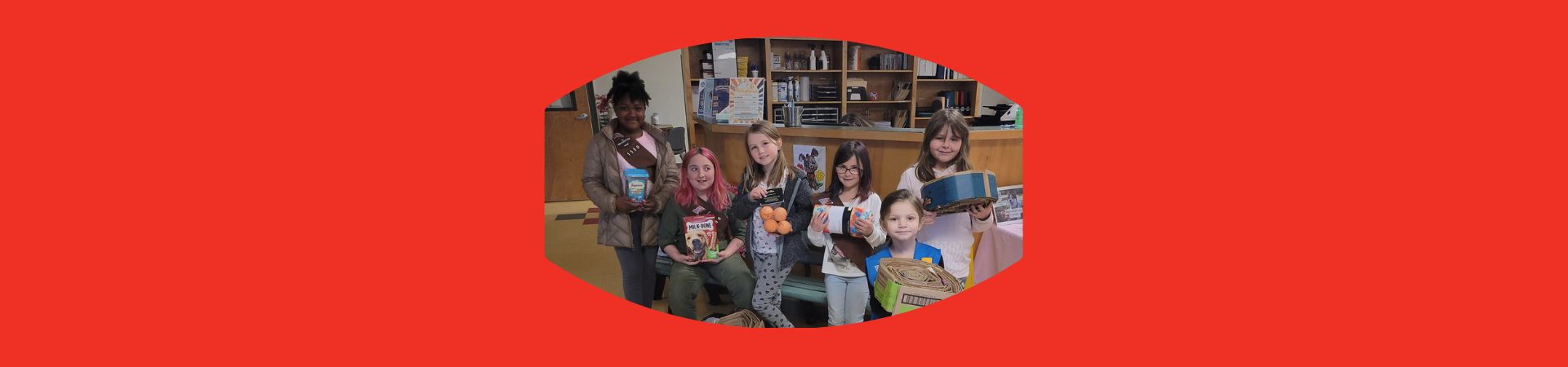  Girl Scouts from Troop 1550 at the Humane Society of Waterville holding their donations 