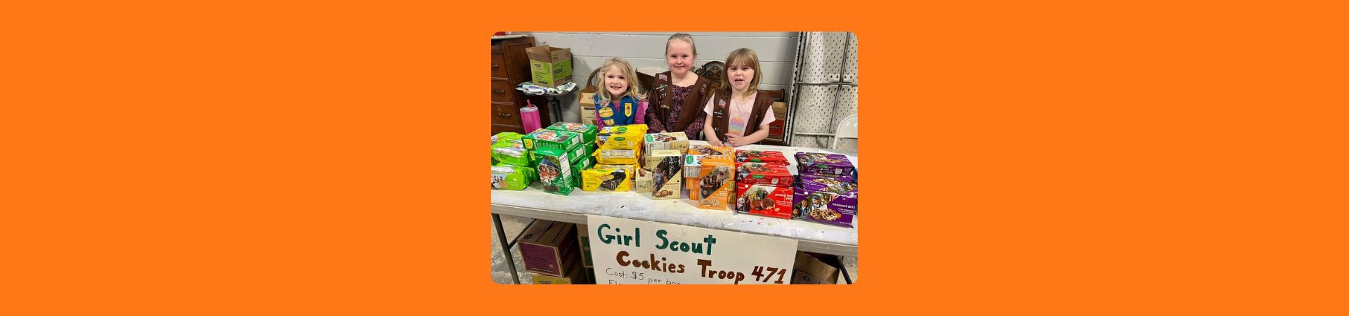  Three Girl Scouts from troop 471 at their cookie booth 