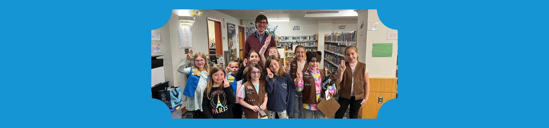  Girl Scouts from Troop 5002 at the Baxter Memorial Library 