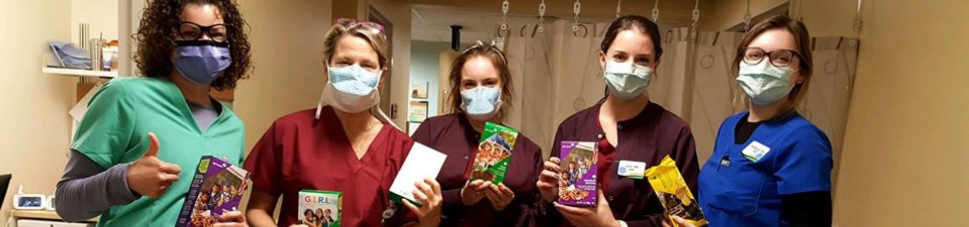  York Hospital's Medical Surgical COVID-19 Unit workers holding donated Girl Scout Cookies 