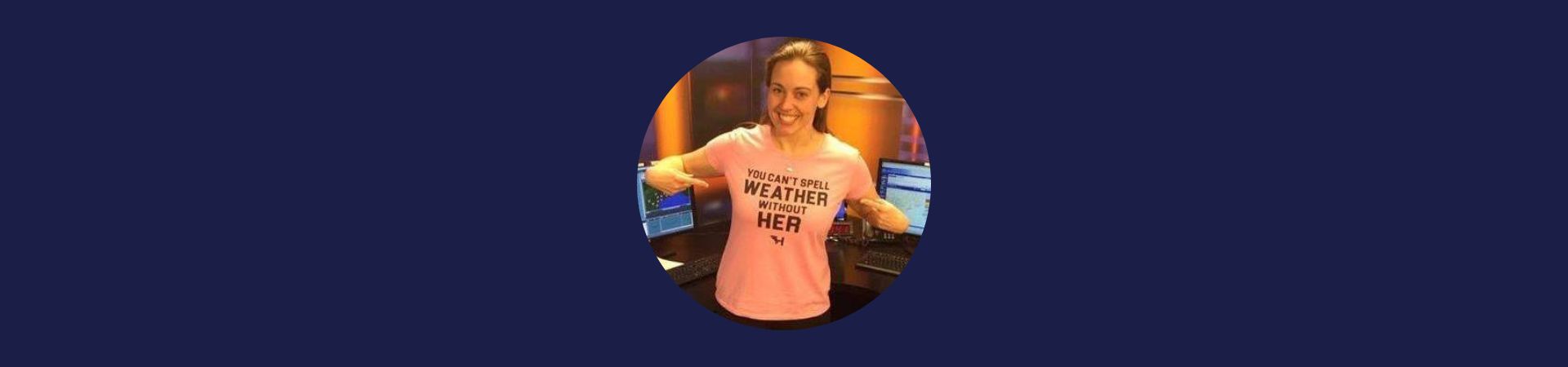  Jessica Conley pointing to her weather shirt 