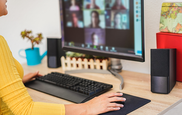 woman working at a desk on her computer