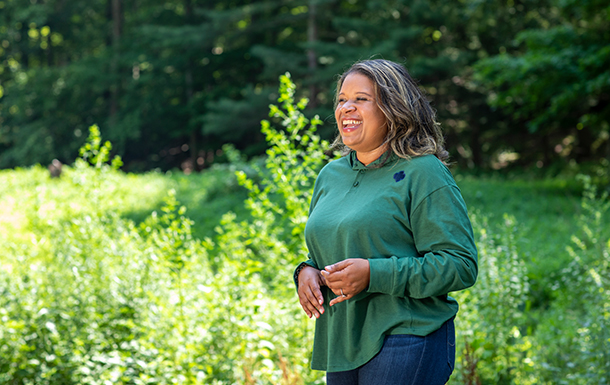 adult smiling in a field