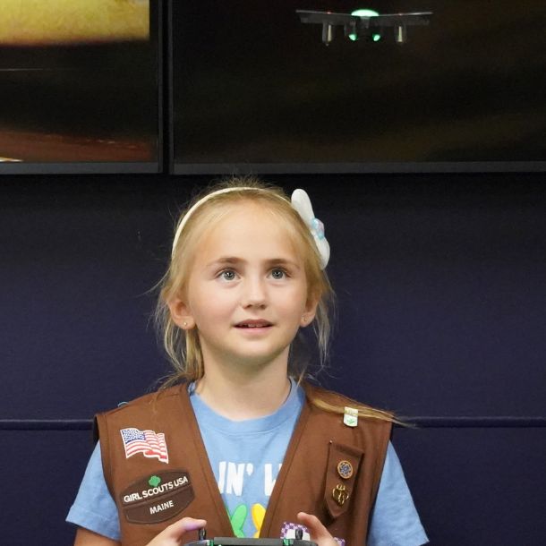 girl flying a drone