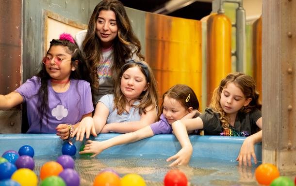leader and girl scouts having fun