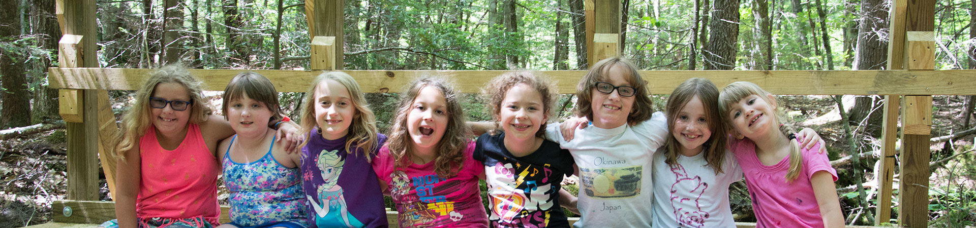  Group of Girl Scouts sitting on a bridge at Camp Podicherry made by Sappi employees 
