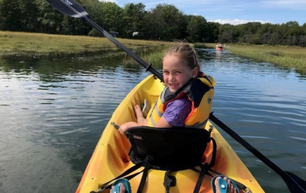 girl in a canoe on the water