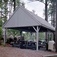 shelter with picnic tables at camp scelkit