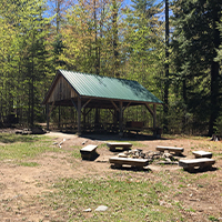 Tall pines pavillion fire pit at Camp Pondicherry