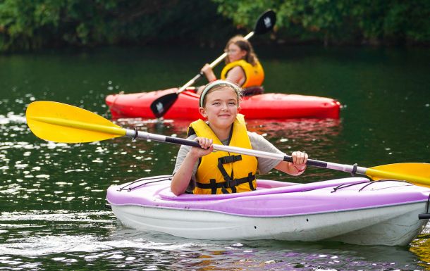 girl scout in a kayak