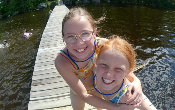 girl scouts on waterfront dock