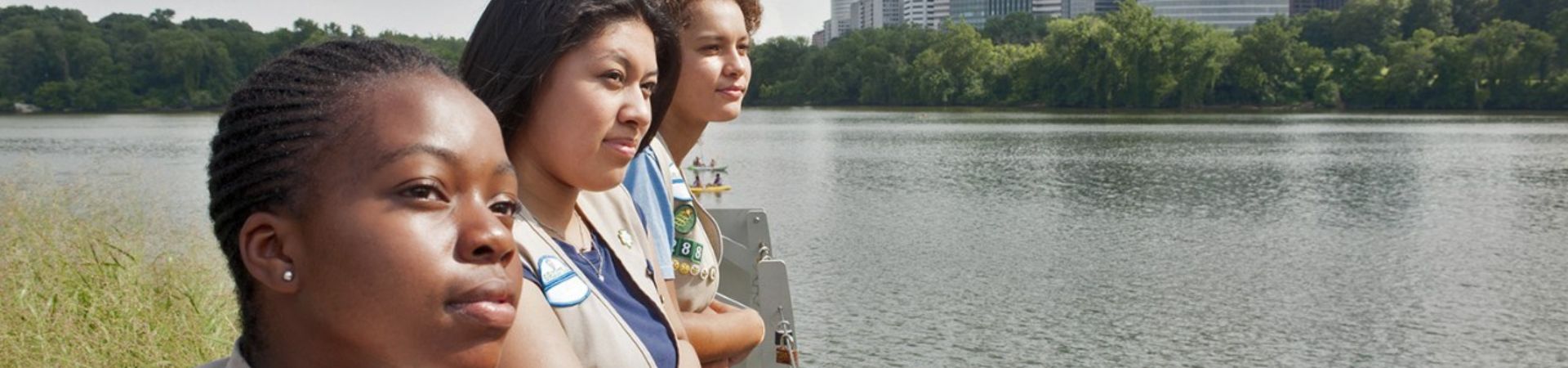  Three Cadette Girl Scouts staring in the distance 