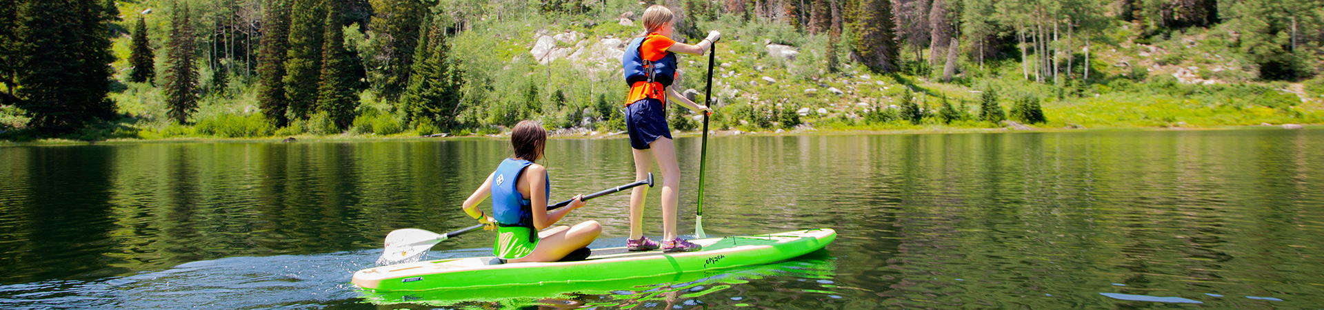  Two girls paddleboarding 