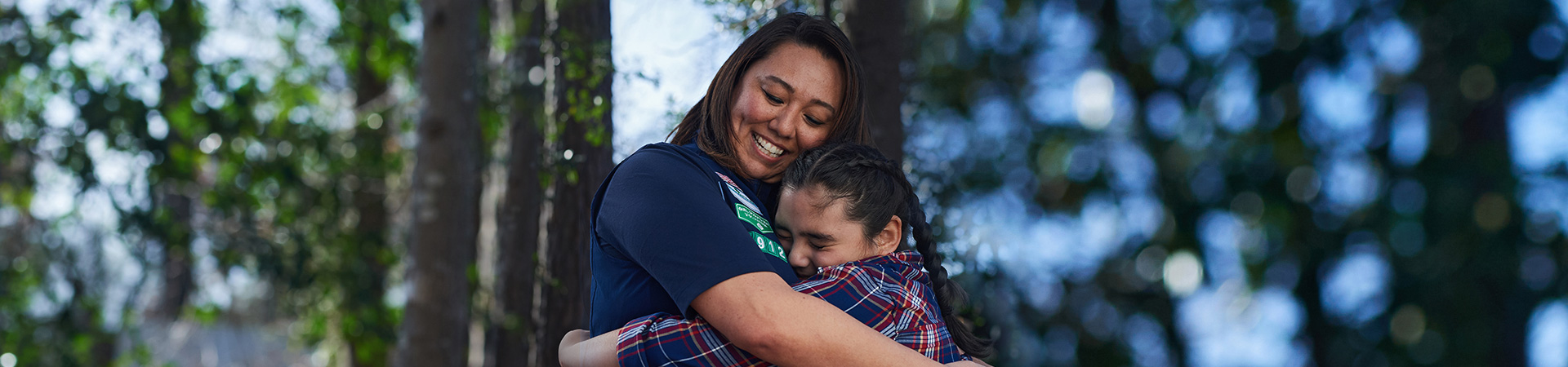  A volunteer hugging a girl 