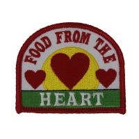 Food from the Heart patch showing grass, a sun, and three hearts
