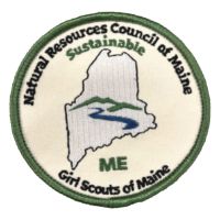 Sustainable Maine patch with an outline of the state of Maine with a mountain and river shape inside it