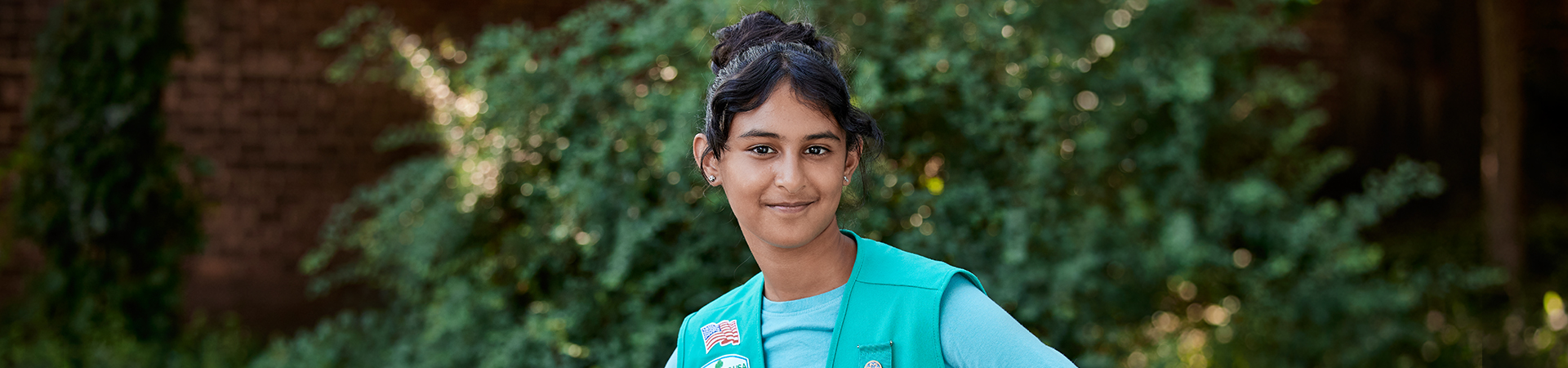  Junior Girl Scout standing outside 