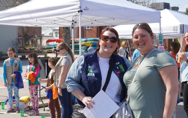 girl scous and volunteers at an event