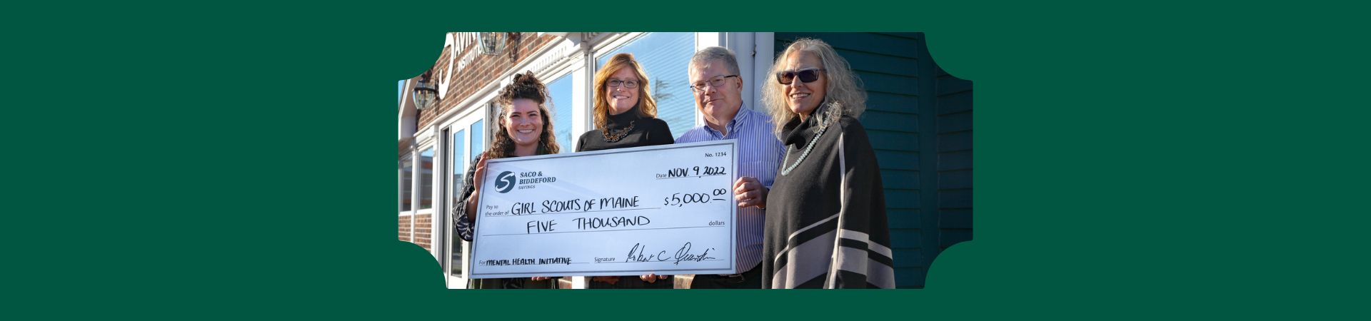  Saco Biddeford Savings employees giving giant check to GSME employees 